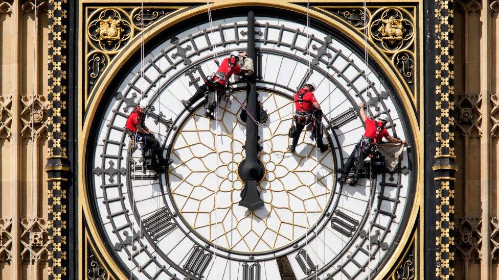 People abseiling down big ben clock face