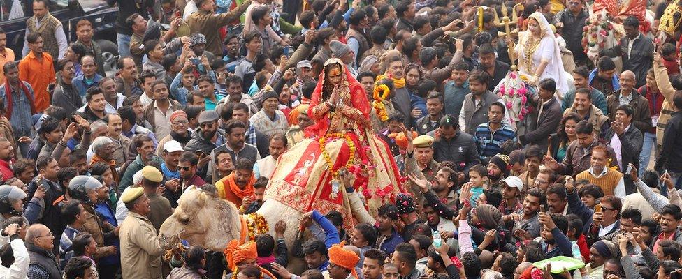 Lakshmi Narayan Tripathi, chief of "Kinnar Akhara" for transgenders, rides on a camel