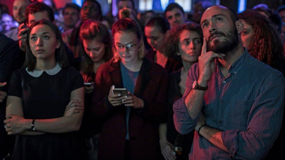 Macron supporters watch the debate in Paris on 3 May 2017