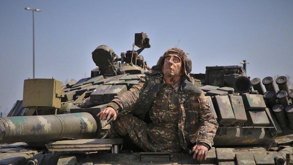 A mannequin of an Armenian soldier in a captured tank