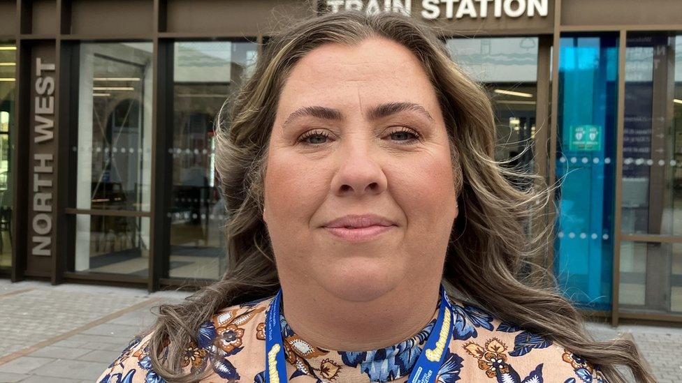 Shona McEleney stands outside Derry train station