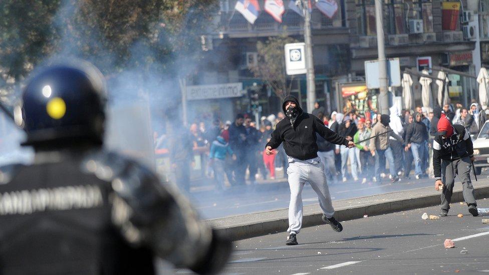 Anti-gay protestors surrounded by police at Belgrade's pride, Belgrade, Serbia 2014.