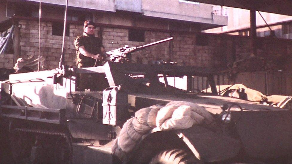 Antoun in an armoured car during the Lebanese civil war