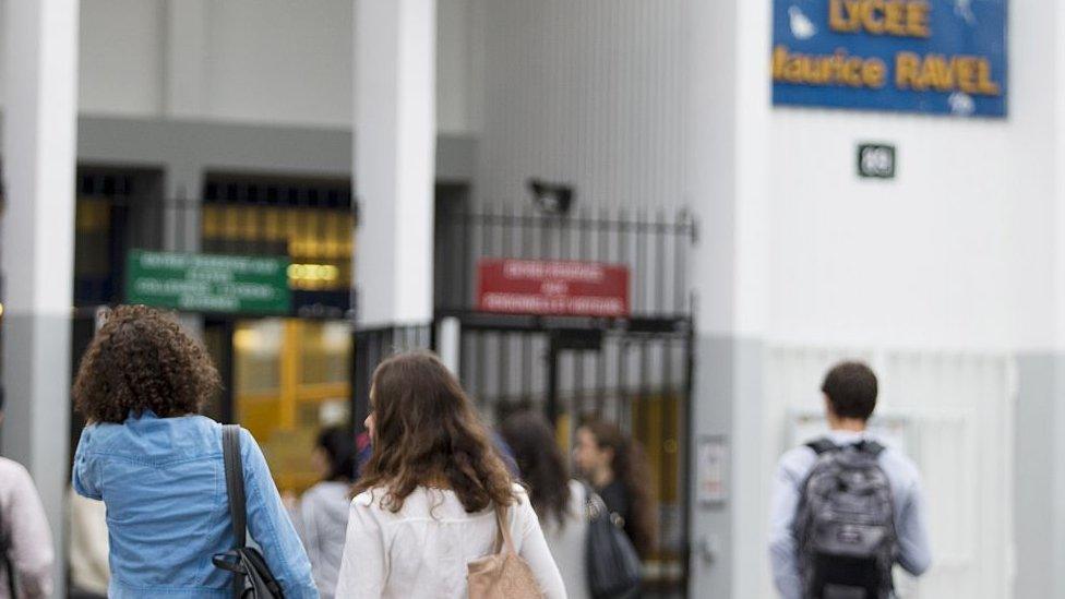 Students arrive at the Maurice Ravel high school in Paris in 2015