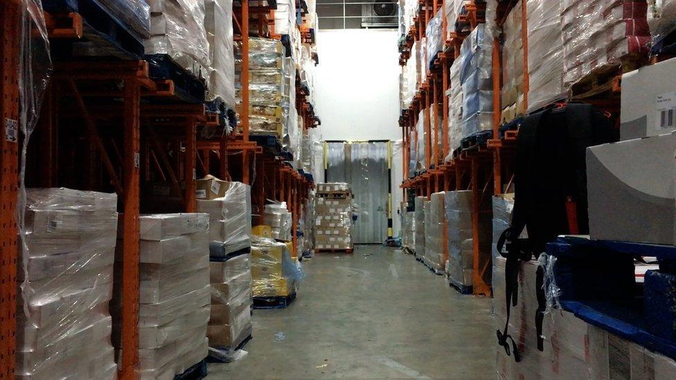 The cold storage area of the warehouse full of pallets