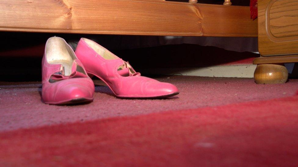 Red shoes Margaret wore when she was presented with an MBE by the Prince of Wales