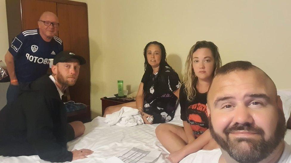 Steven and fellow passengers in the hotel room they are having to share