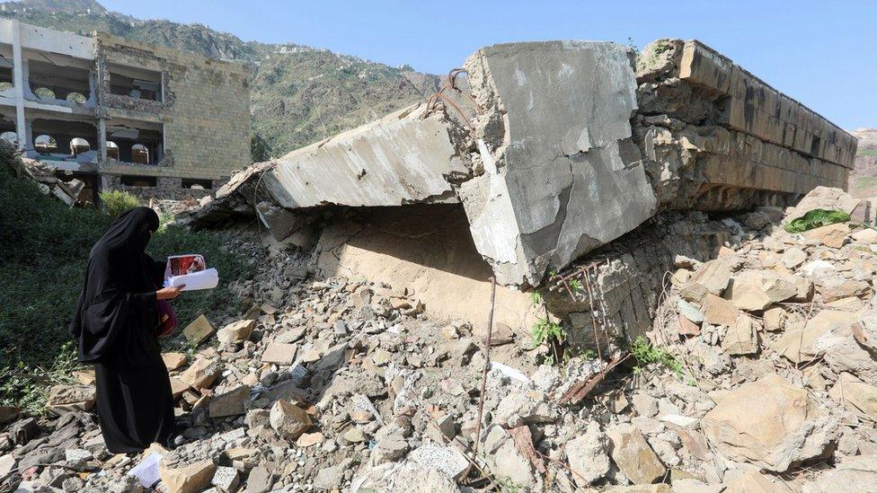 A Yemeni member of a school administration inspects the damage on the first day of the new academic year on September 16, 2018, at a school that was damaged last year in an air strike