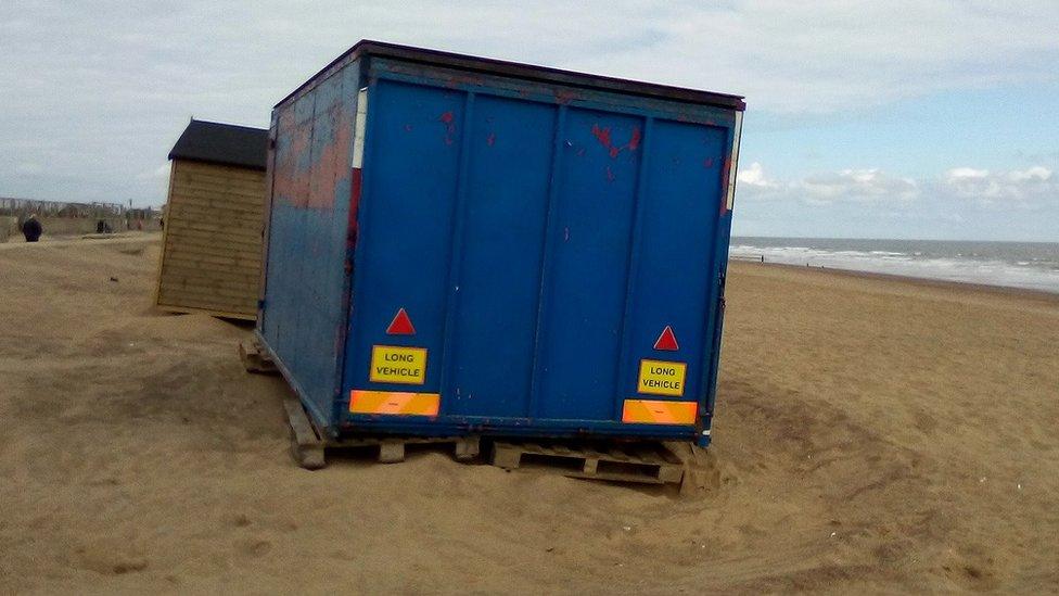 Metal container on beach