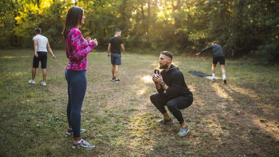 People exercising stock image