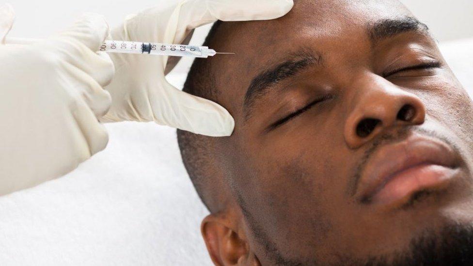 Man having forehead injected