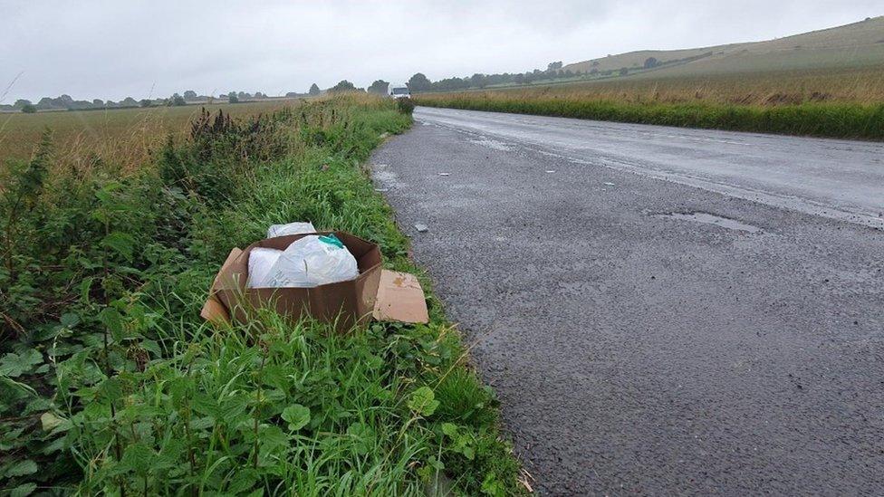 A box of rubbish left next to the A361