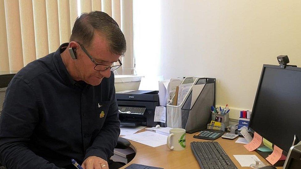 James Anderson at an office desk