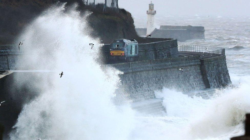 Waves crash against the sea wall near Whitehaven in Cumbria