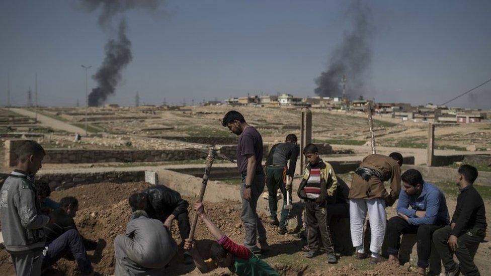 The body of Khadeer Hassan killed in the fighting in Iraq's Mosul is buried, 26 March 2017