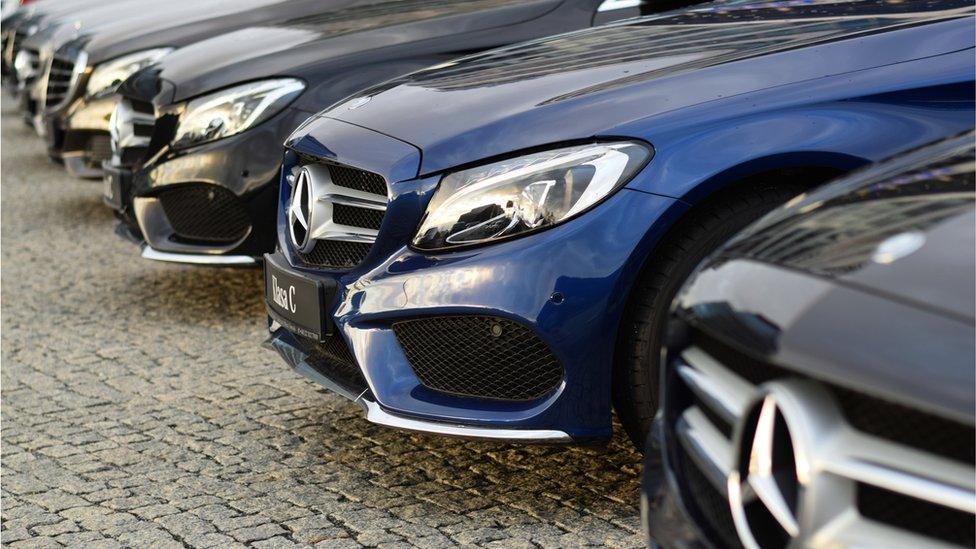 A row of Mercedes Benz cars