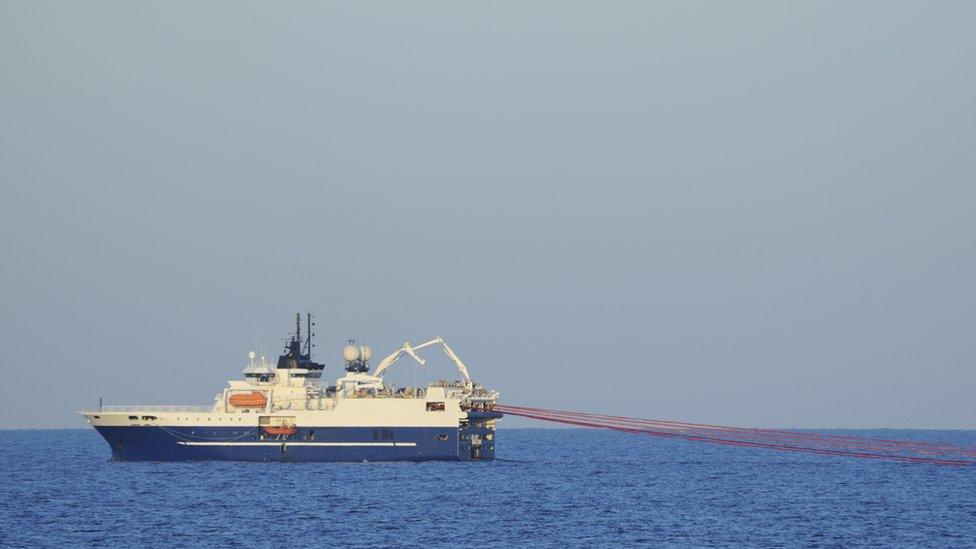 A boat conducting a seismic survey