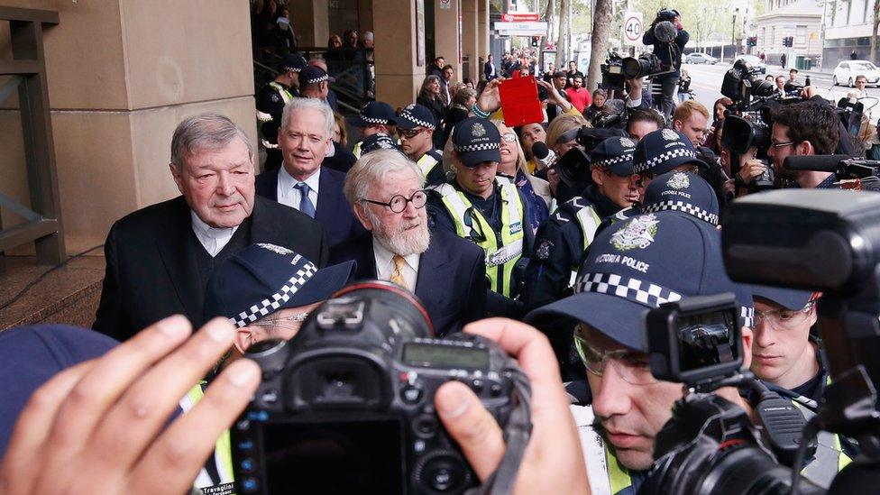 Cardinal George Pell leaving a Melbourne court in October