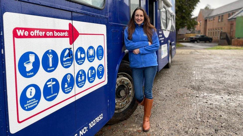 Ruth Poyner next to bus