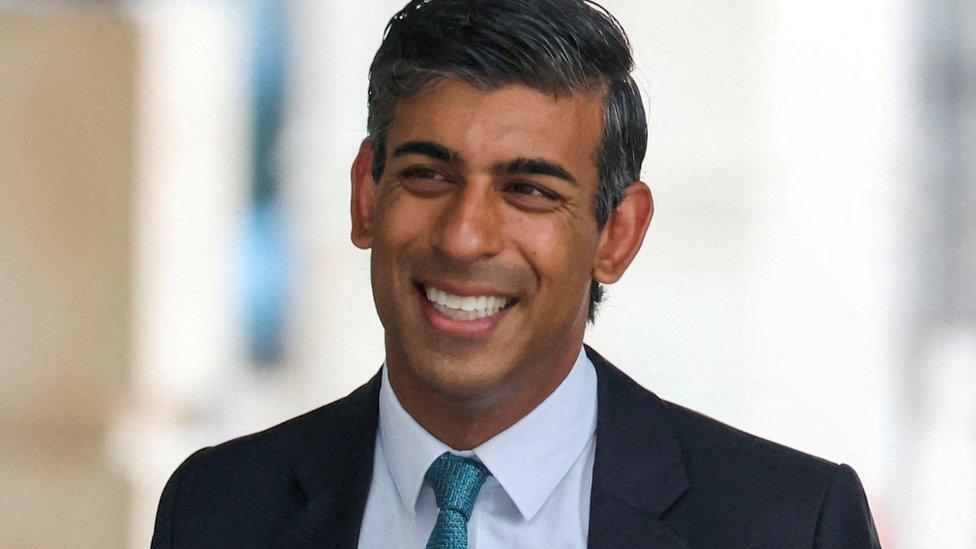 Rishi Sunak smiling