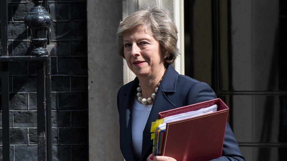 Theresa May leaves number 10 Downing Street to attend Prime Minister's Questions