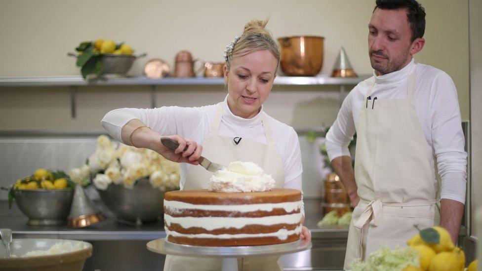 Claire Ptak puts finishes touches to the wedding cake