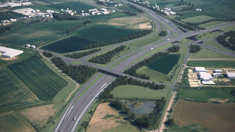 An artist's impression of an aerial view of the new Roxton Road bridge over a dual carriageway. It is surrounded by a patchwork of fields, trees and warehouses.