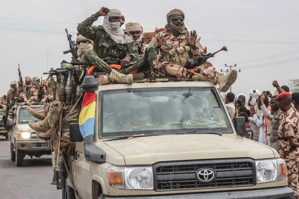 Chadian soldiers celebrate as they parade in N'Djamena on Sunday.