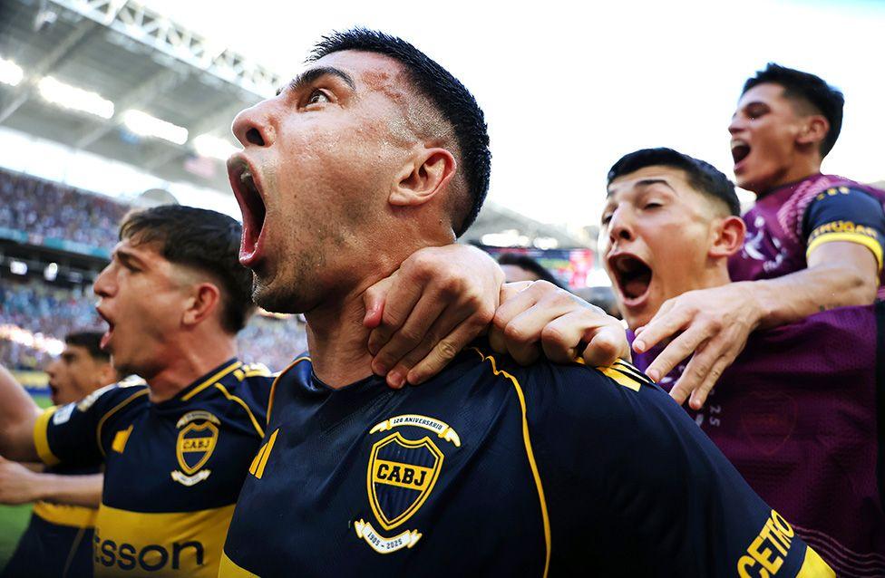 Boca Juniors' Rodrigo Battaglia celebrates with teammates after scoring his team's second goal during the FIFA Club World Cup against Benfica in Florida. Photo by Dan Mullan