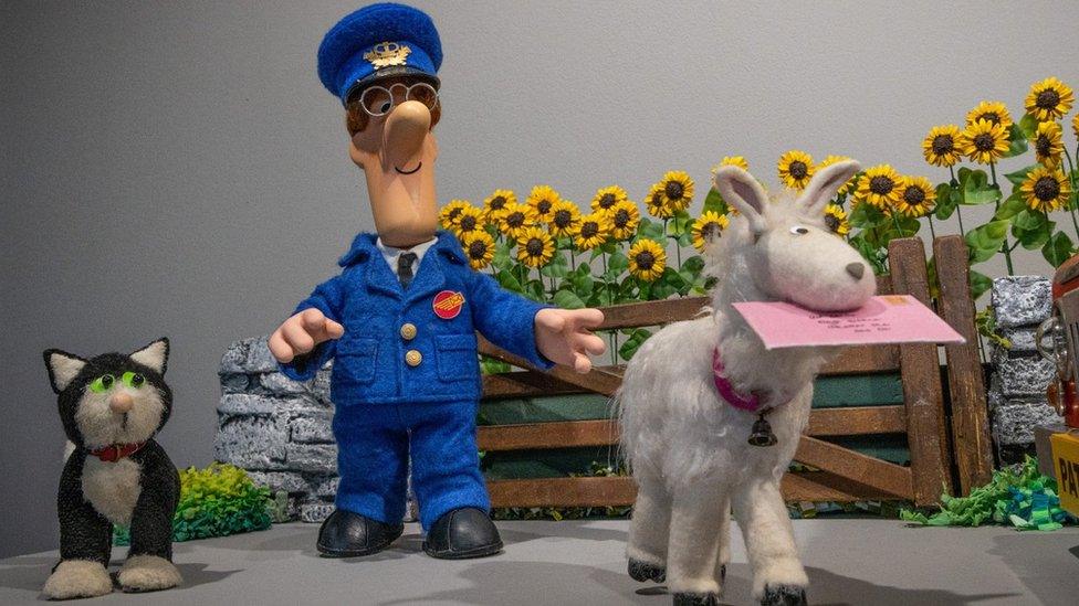 Postman Pat chasing a goat with a letter