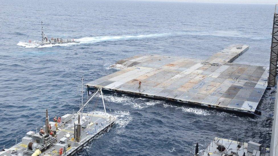 US military handout image showing the construction of the floating JLOTS pier in the Mediterranean Sea (29 April 2024)