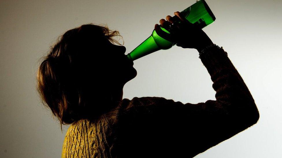 Woman drinking from a bottle