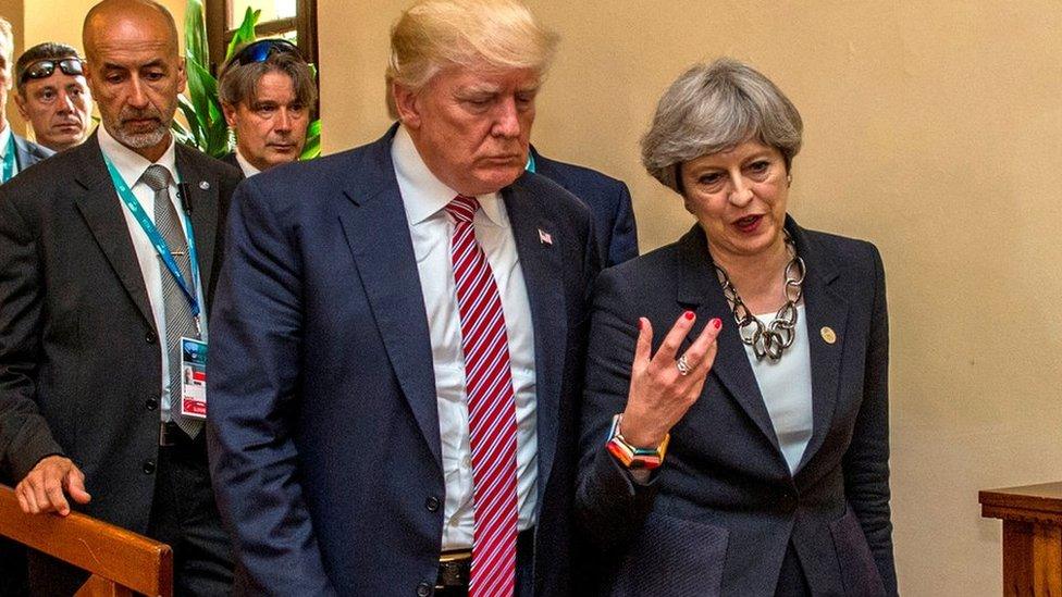 US President Donald Trump walks with UK Prime Minister Theresa May at the G7 summit in Taormina, Sicily, 26 May