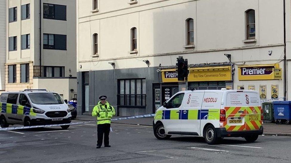 police standing outside with road closed in Butetown