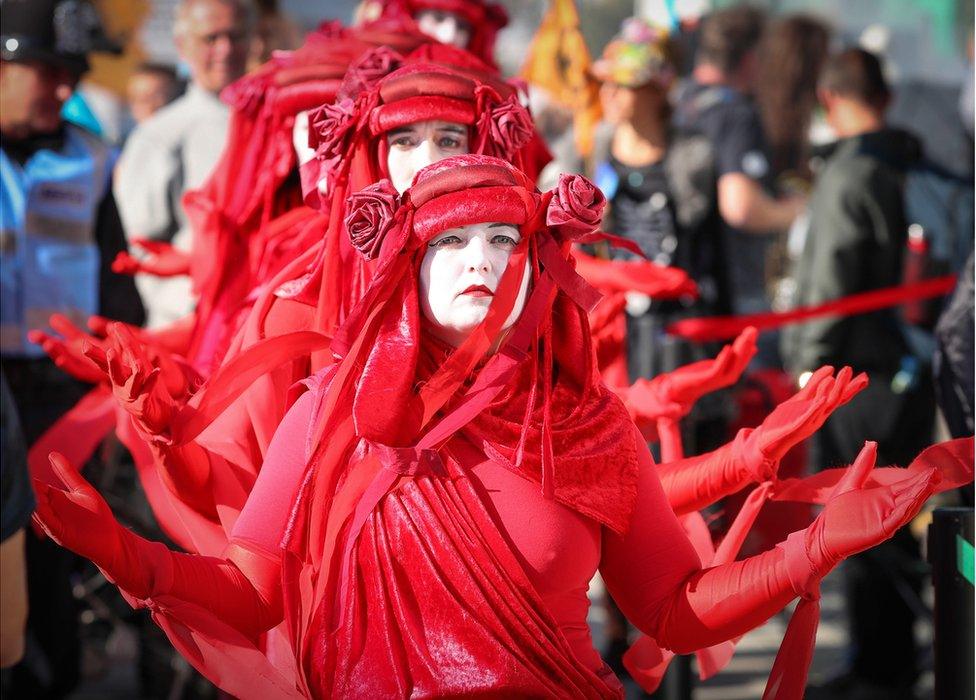 Activists dressed in red