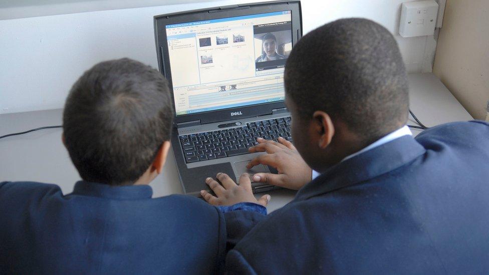 Boys on a computer at school