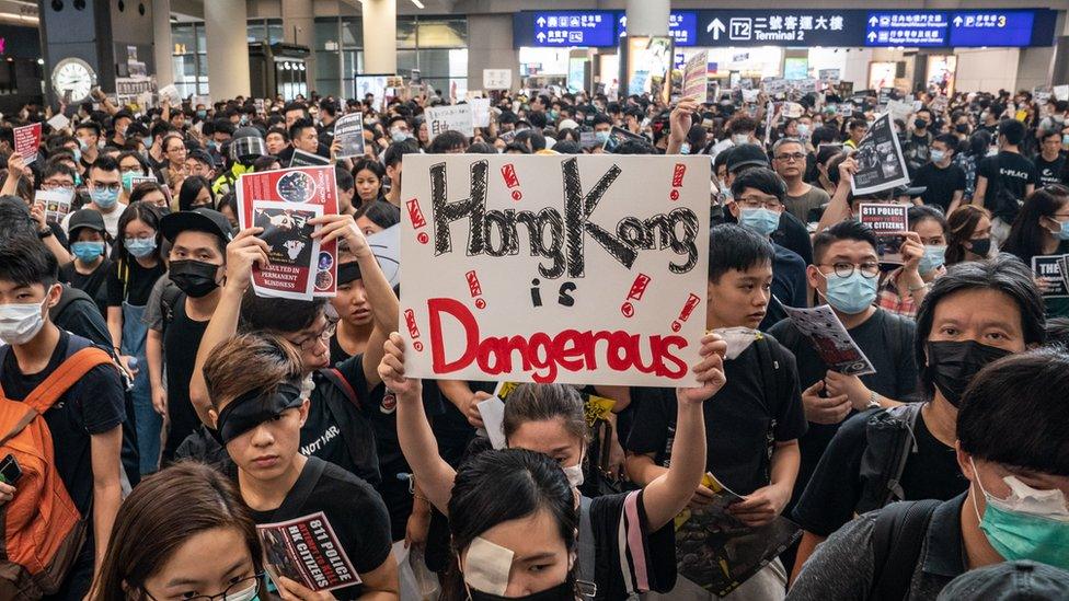 Protesters occupy the arrival hall of the Hong Kong International Airport during a demonstration