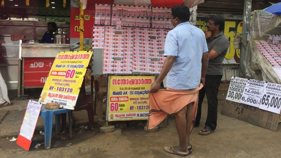 Man selling lottery tickets in the city of Thiruvananthapuram (Trivandrum), Kerala, India.