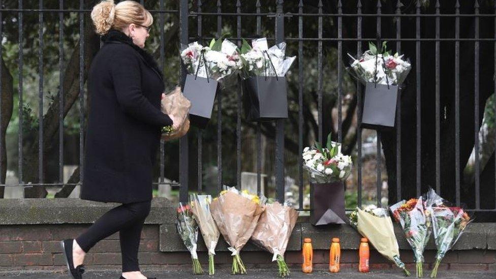 Three energy drink bottles were left at the scene along with flowers