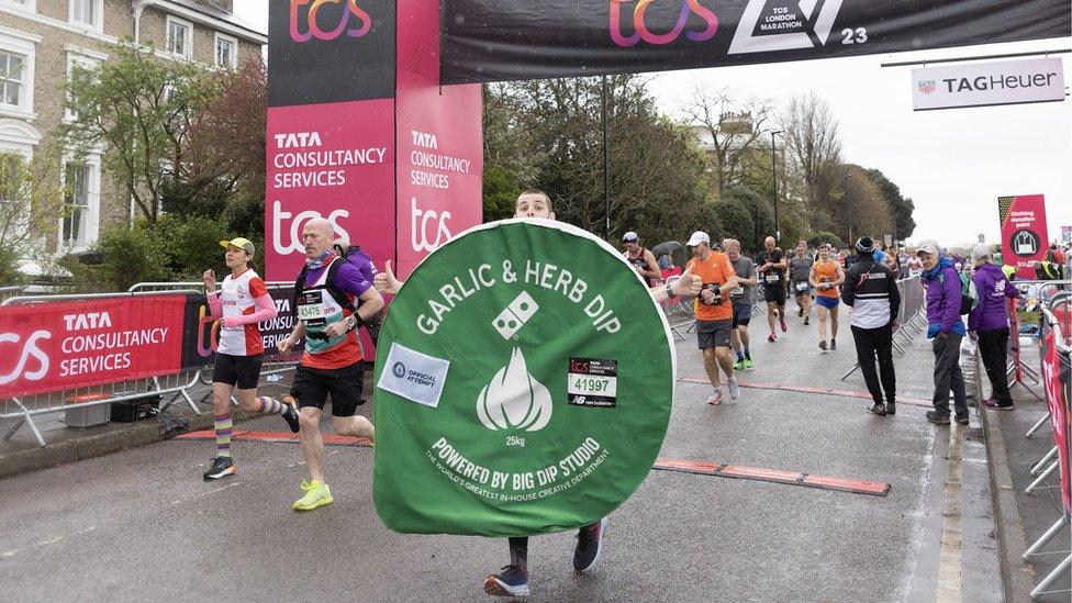 Runner dressed as a garlic and herb dip