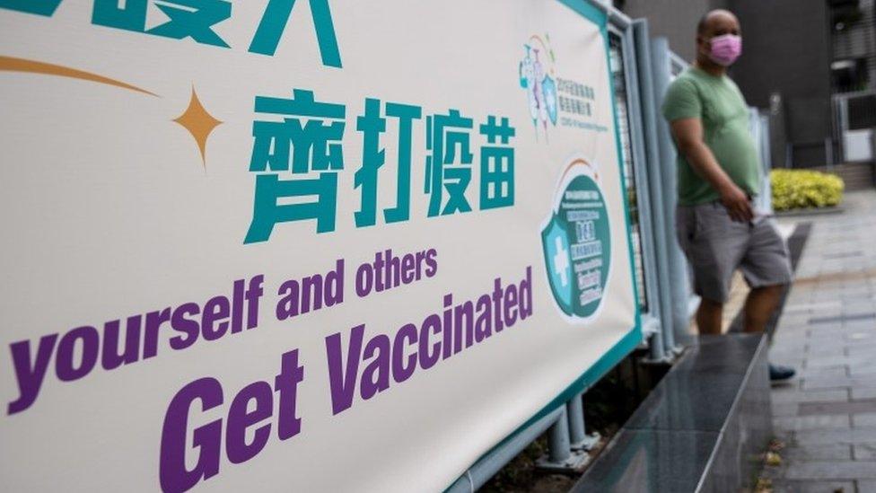 A man walks out of a community vaccination centre for the Sinovac Biotech Ltd. Covid-19 vaccine in Hong Kong