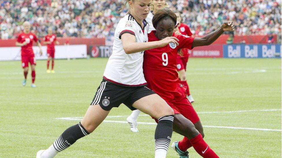 England's Eniola Aluko and Germany"s Melanie Leupolz at the Women"s World Cup 2015