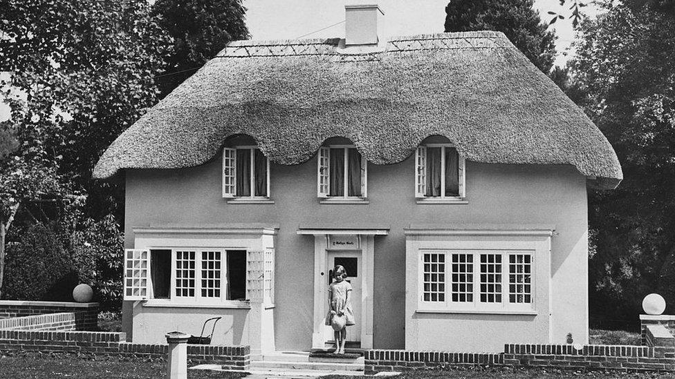 Princess Elizabeth stands in the doorway of Y Bwthyn Bach ('The Little Cottage' in Welsh), situated in the grounds of the Royal Lodge, Windsor, June 1933