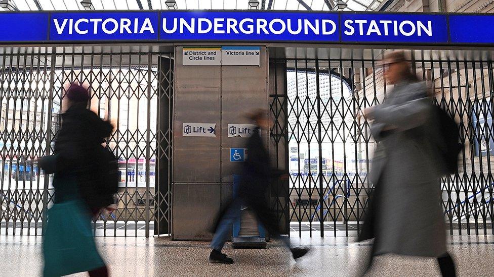 Commuters at a locked Victoria station