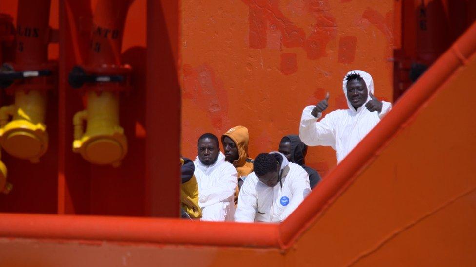 Migrants on board the tug boat