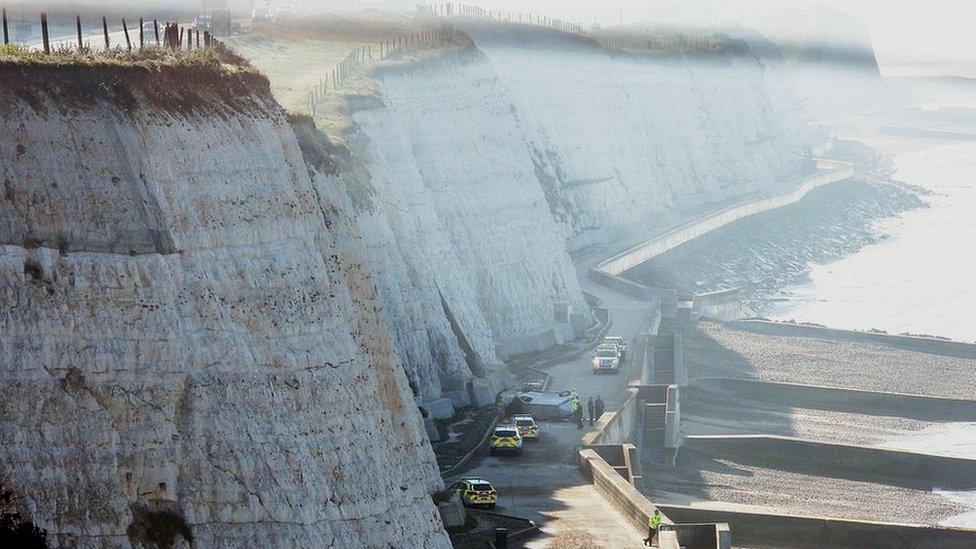 Van seen at bottom of cliffs