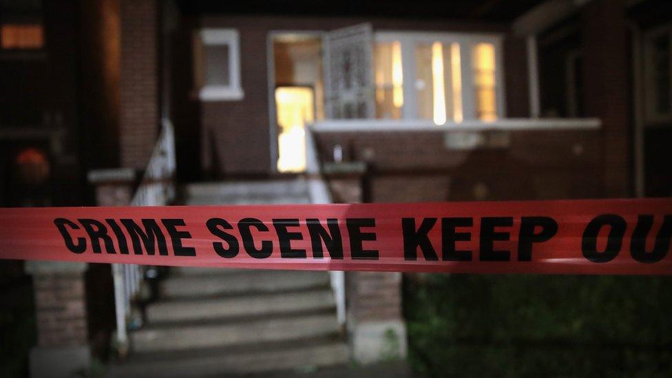 Crime scene tape is stretched around the front of a home where a man was shot in Chicago, Illinois, on 28 May 2017