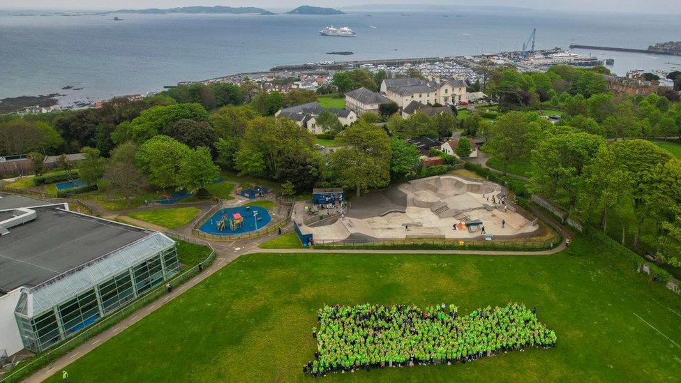 Volunteers drone shot with sea in background