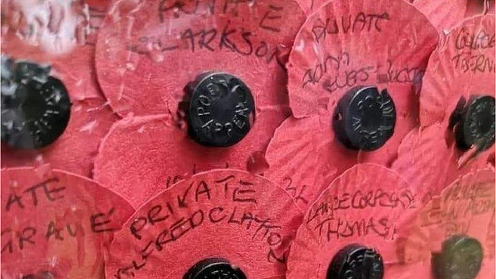 Close up of individual poppies on the Poppy of Honour memorial