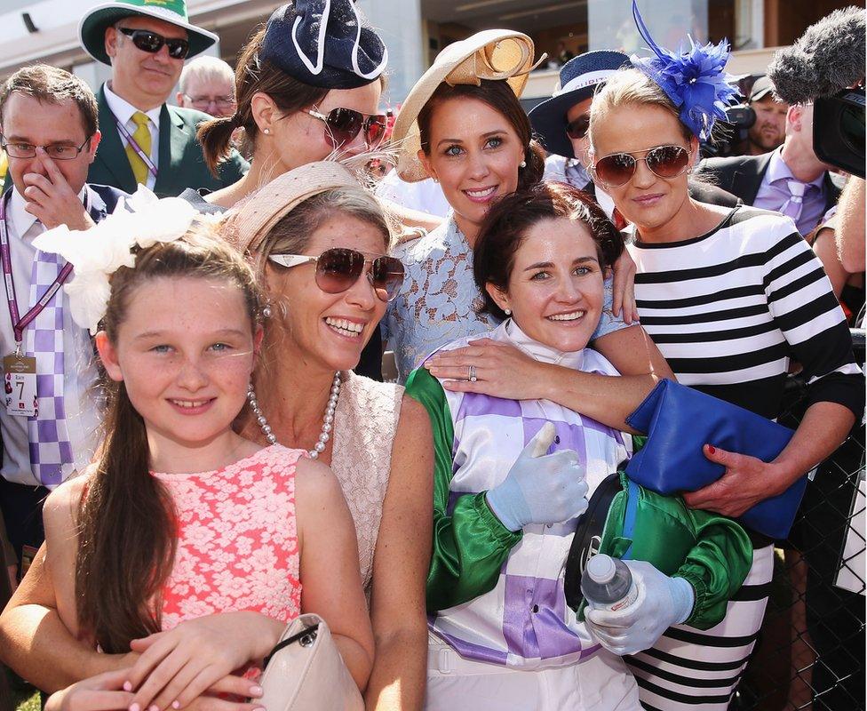 Michelle Payne celebrates with her sisters at the Melbourne Cup (3 Nov 2015)